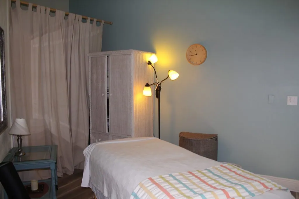The treatment room, window light on the massage table